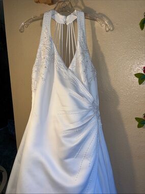 Signature wedding dress white satin style halter-style gown featuring a ruched